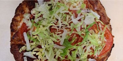 Ranch BLT Pizza, lettuce tomato, bacon, mozzarella and house-made ranch